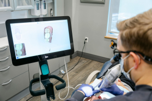 Dr. Ned Gold using scanner wand 