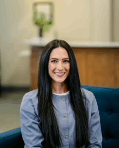 Dental hygienist smiling in a dental office, showcasing a welcoming atmosphere at Progressive Dental Care in South Portland.