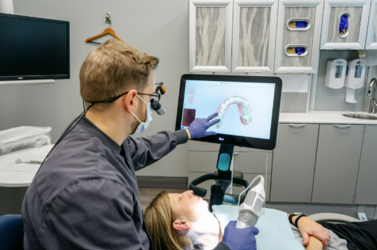 Cosmetic dentist using digital dental scanning technology during a cosmetic dentistry appointment for a patient from Cape Elizabeth, ME.